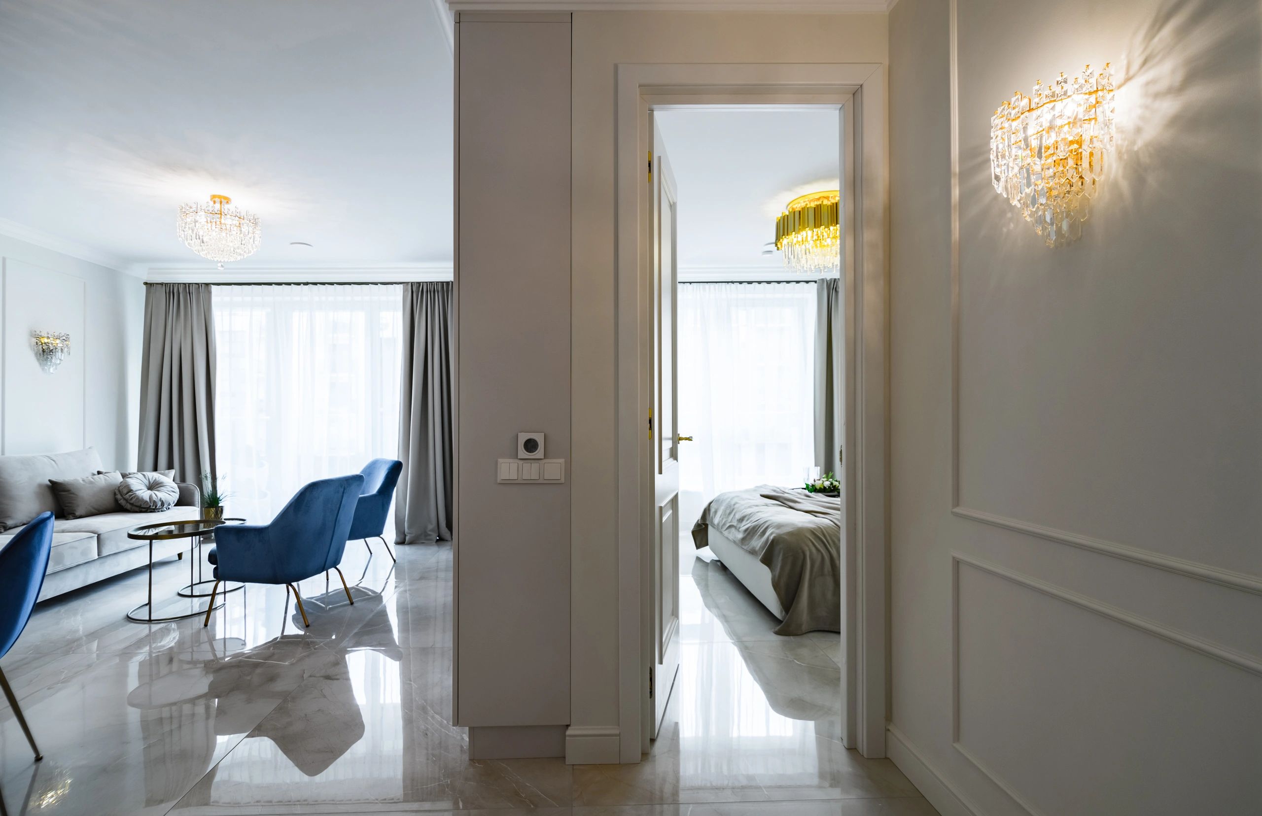 Modern classic apartment living room with doorway to bedroom