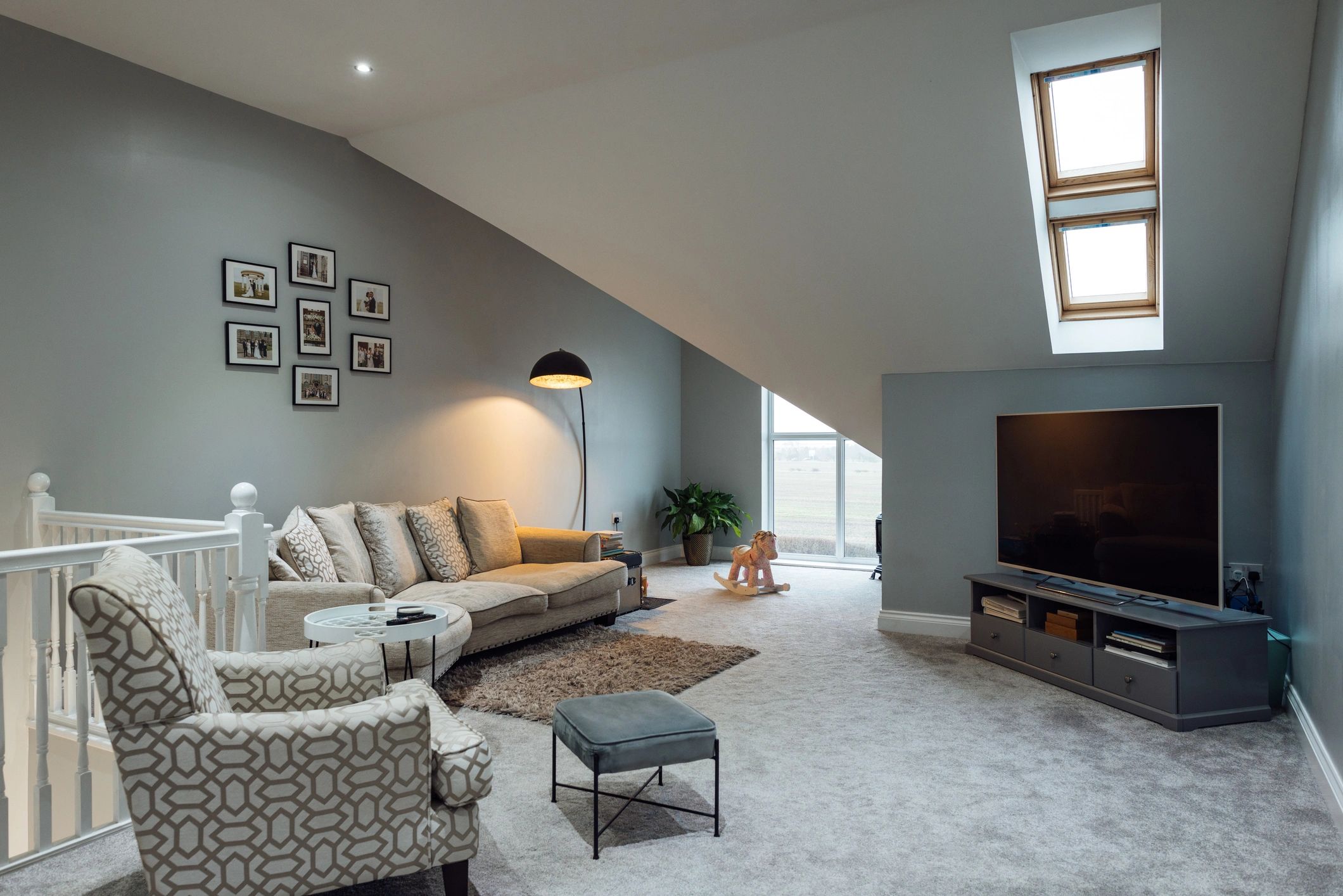 Wide view of a luxury modern living room with seating area