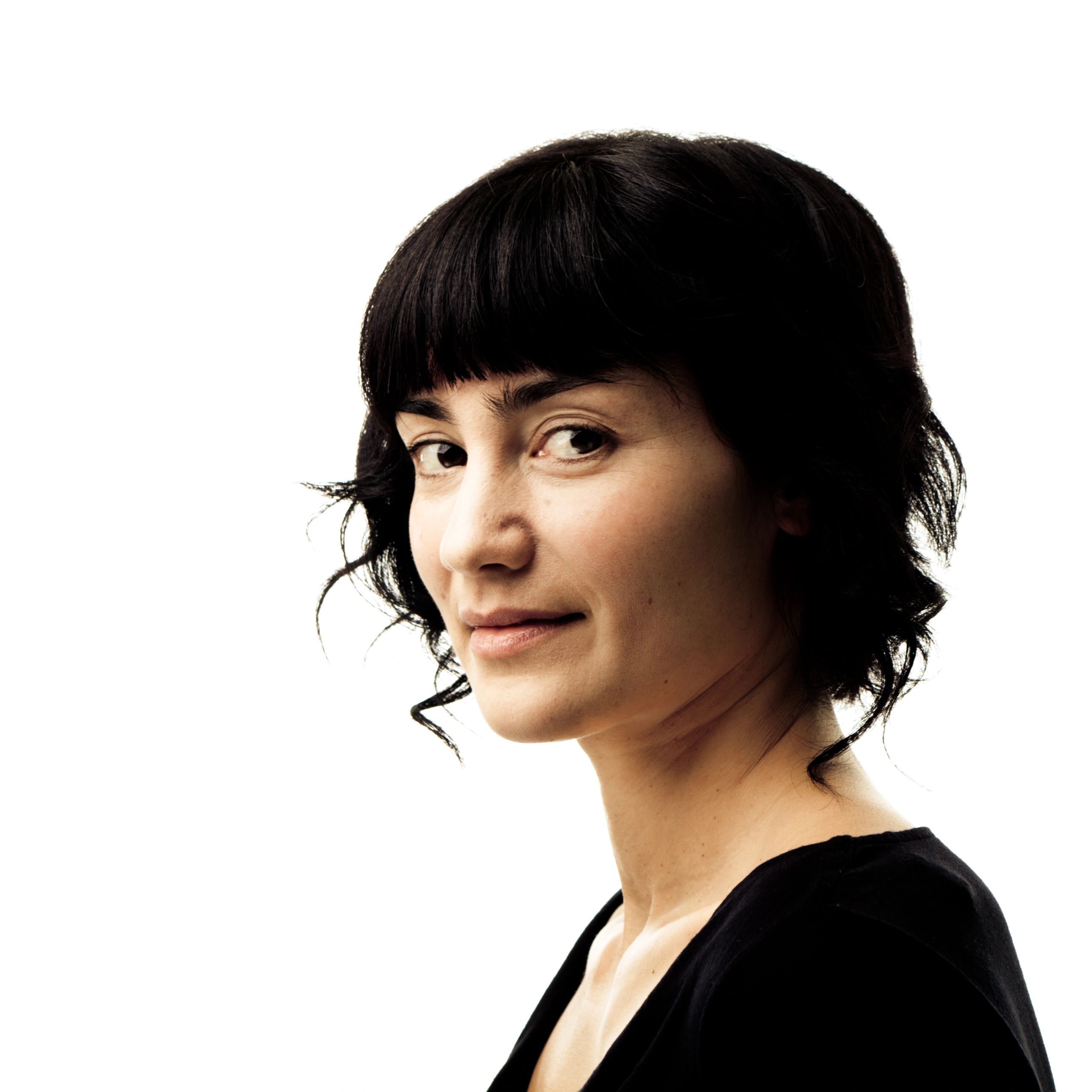 Portrait of a young woman smiling on a white background