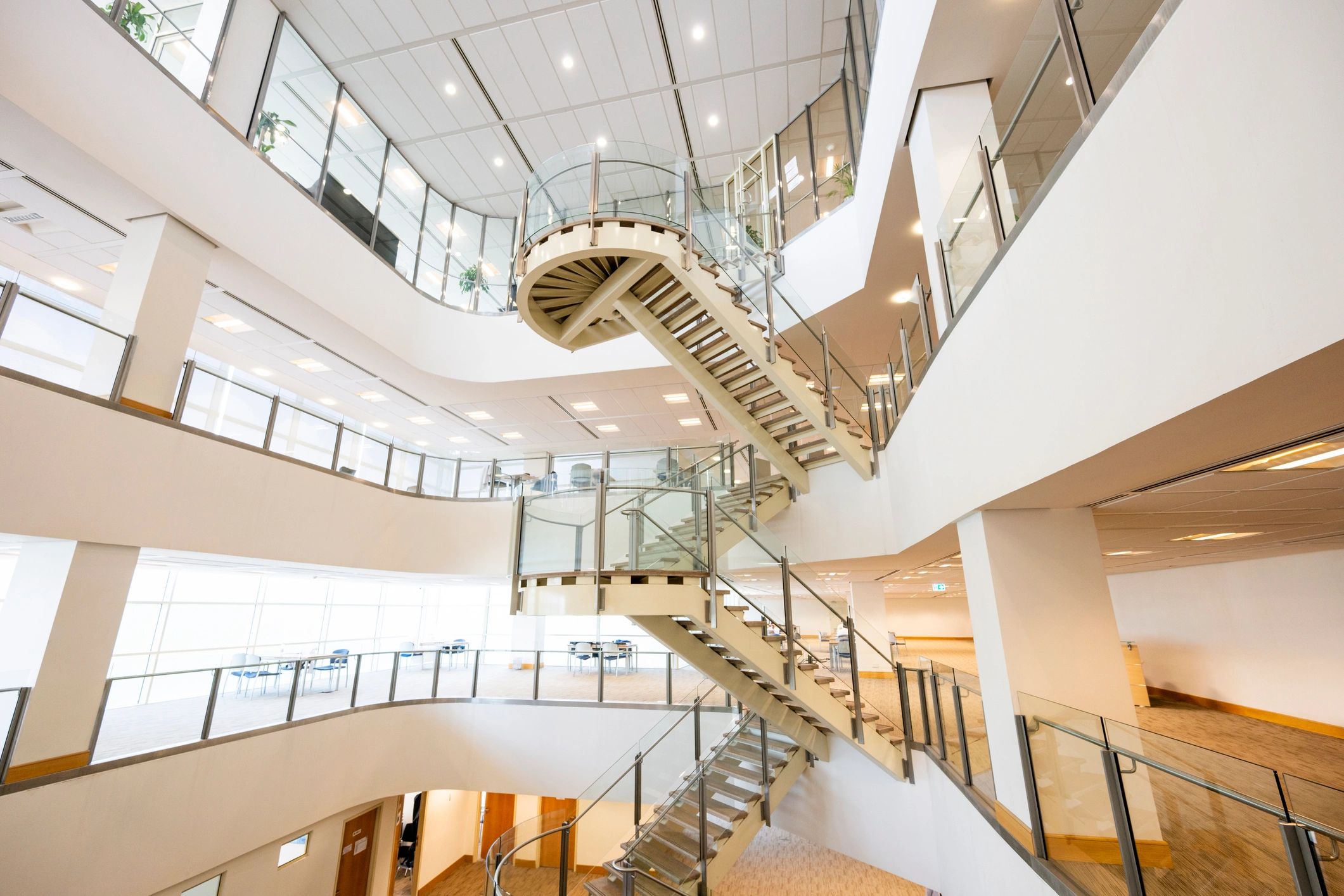 Bright atrium staircase in modern building