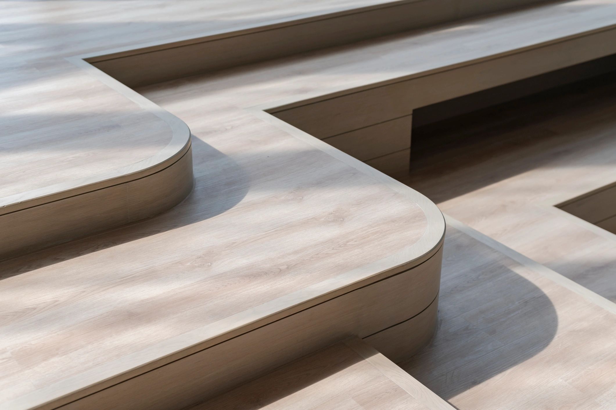Curved wooden staircase in a modern interior
